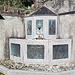 <b>Fontana di San Francesco a Giuslino (1182-1982), opera di Bruno Gandola.
Formelle di L. Teruggi, W. Pizzi, N. Addamiano, G. Baruzzi, B. Gandola, S.Scelba.</b>