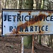 Ortsausgangschild im Wald