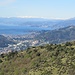 L'aeroporto, Pegli e la costa ligure di ponente con le Alpi innevate.