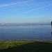 Start am Deich nördlich des Tossener Friesenstrandes.<br /><br />Die vielen Kräne gehören zum Jade-Weser-Port, dazwischen liegt das Jadefahrwasser.<br /><br />