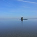 Der Wasserstand zur Zeit der Aufnahme entspricht etwa dem mittleren Niedrigwasser. Er würde (am Tag der Tour) noch ein paar Zentimeter sinken.<br />Blöd, dass der Turm grad mitten in der Bajle steht.<br /><br />Der Tidenhub ist in dem Bereich ziemlich groß für das Deutsche Wattenmeer, fast vier Meter im Durchschnitt. Deshalb ist der Turmstumpf auch so grünlich mit Algen bewachsen.