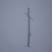 Das Gipfelkreuz vom Rütistein (2025m) vor weissem Hintergrund - Nebel total !