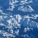 verschneite Berge vom Flugzeug aus