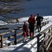 Attraversato l'ultimo ponte sul torrente, iniziamo la salita in direzione della Casera di Porcile (Ilaria, Mau, e Lorenz, l'unico di noi con gli sci)