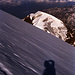 Über dem Monte Pasquale zeigt sich in der Ferne die Berninagruppe