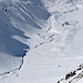 Der Blick vom Gipfel des Piz Laviner hinuter zur Alp d'Err