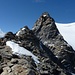 Rückblick zum Gipfel des Piz d'Arlas 3467m, wo man in die Scharte abseilt (man beachte den klitzekleinen Punkt unterhalb des Gipfels = Bergsteiger am abseilen)