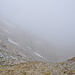 Tiefblick zurück ins wieder wolkenverhangene Val Lumnezia.