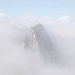 Poncione di Maniò, cima 2910: appare come un fantasma bucando la nebbia.