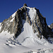 Straight up the big icefield (section 1, 150m), moving right to get into, a narrow gulley of two pitches (section 2, middle of the picture), then the icefield on the top right (section 3) to reach the top crest. From there summit or descend by normal route on the left