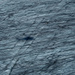 Der Schatten unseres fliegenden Untersatzes auf den Eisstrukturen des Rhonegletschers