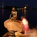 A Kopenhagen's classic: the little (indeed little) meermaid molested by busy tourists