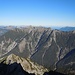 Hinter unbekannten Gipfeln der Liegfeistgruppe die Tannheimer, ein Stück vom Forggensee und der Säuling