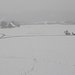 Sumiswald "versinkt" im leichten Schneegestöber - hinter dem Hof rechts ist knapp der Kirchtum erkennbar