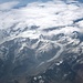 Die Southern Alps mit Gletschern, die im Osten bis auf 700 m und an der hier wolkenverhangenen Westküste (Franz-Josef- und Fox-Gletscher) bis auf 300 m herunterfließen
