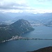 Blick auf San Salvatore, Lugano und den Damm von Melide
