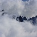 Gipfelaussicht Agassizhorn (3946m):  <br /> <br />Brodelnde Wolken umhüllen die Gipfel der Lauteraar Rothörner (P.3478m links und P.3466m rechts).