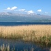 Mali i Thatë, seen from across Lake Ohrid. The left (seemingly higher) end of the ridge is in Macedonia, while the true summit is about in the middle of the ridge of Mali i Thatë