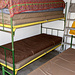 L' alpeggio sistemato a rifugio:
stanza adiacente con dormitorio (3 brande e materassi e 7 materassi)