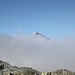 <b>Dalla nebbia spunta il Pizzo Tambo (3279 m).</b>
