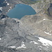Auf dem Piz Terri: Blick zu den Resten vom Glatscher dil Terri und dem (noch) namenlosen Gletschersee.<br />Hinten ein Ausschnitt aus der Greinaebene.