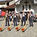alpenhorn musicians in blowing action