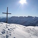 Gipfelkreuz auf dem Vorderunnütz - im Hintergrund von links Großglockner, Großvenediger und rechts vom Kreuz das Rofan