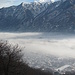 Nebelschwaden über der Talebene, dahinter Tignolino