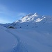 Tiefer Winter im Val Fedoz: Ankunft in Petpreir, rechts Ca d'Starnam, darüber der Piz da la Margna